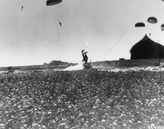 Photo:  SC354700 - HOLLANDThe haystack at right would have softened the landing for this paratrooper who hit the earth head first during operations in Holland by the 1st Allied Airborne Army. 24 September 1944.