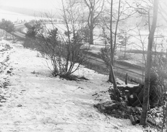 Photo:  SC246723 - The members of the 101st Airborne Division, right, are on guard for enemy tanks, on the road leading to Bastogne, Belgium. They are armed with bazookas. 23 Dec 1944.