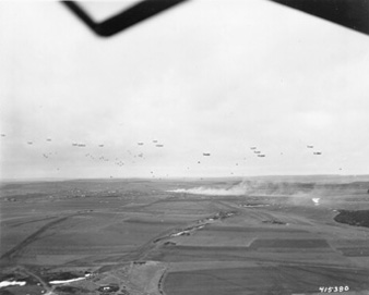 Photo:  SC415380 - BRIEALF, GERMANY  C-47s of the 101st Airborne Division drop supplies on the 4th Infantry Division Sector. This became necessary when rains and early thaw made roads impassable in this area. The supplies consisted of rations, gas, and ammunition. 13 February 1945.
